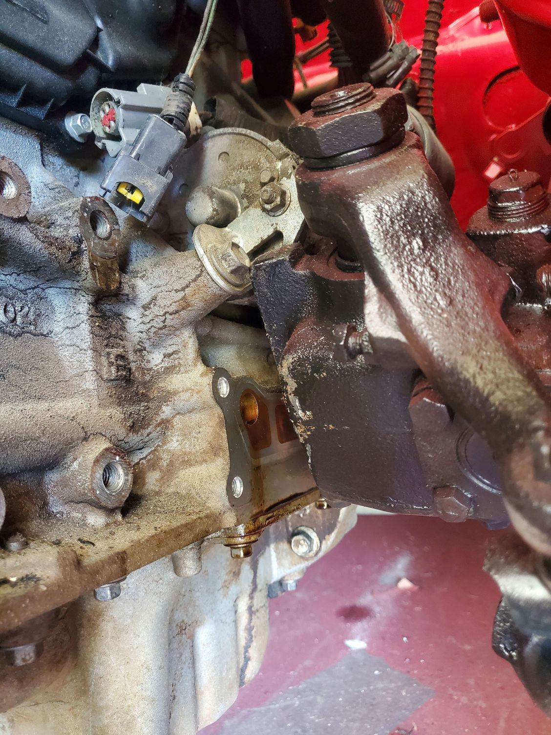 I had to take the oil filter adapter off to slide engine in place, but it will go back on behind steering box. The steering box will end up right beside the mount bosses on the block, so Ill have to weld up a different mount instead of using the factory cast piece for the left side.  