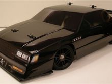 Vintage AE RC12L3 Resto-Mod: 1987 Buick Grand National GNX

 -1S LiPo, Turnigy TrackStar Gen II 1-cell ESC, Trinity Revtech Kill Shot 17.5T motor.

 -Aluminum upgrades from AsiaTees.com.

 -Custom-made battery tray &amp; hold-down; front bumper.

 -Stickers custom-made from photos of my own car ('86 GN) and images downloaded from the internet, then scaled down to fit the 1/12-scale body, and printed on waterproof inkjet white vinyl sticker paper.