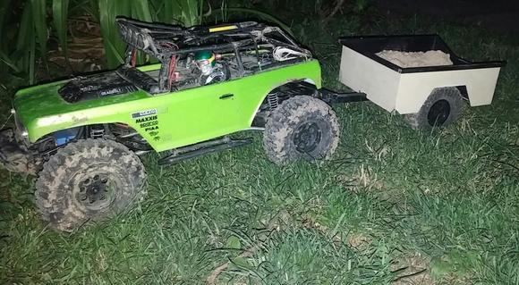 Deadbolt on 8 hole Axial beadlocks, stock electronics, Battery moved forward, pulling a trailer of sand
