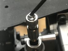 A cut-down, socket head servo screw fixed at the high speed needle. 