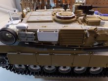 Fabricated my own exhaust deflector.  Simulated padlocks and replacement storage bin handles added.  Handles added to the CIPs (Combat Identification Panels).  Still need to make tie down straps for the CIPs and the ammo box tray. 