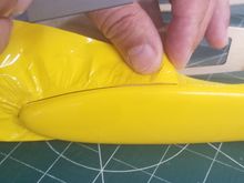 Trimming wing-tip perimeter of excess material -