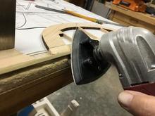 Here I'm using a multi-tool with a sanding head to make the first pass. 