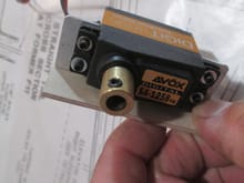 The coupler is secured to the servo with your typical servo screw.