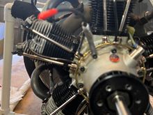 The oil line just exits the bracket towards the front.  When the cowl is on it naturally wants to truck right into front rim. Note nifty red cap.  