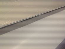 A paste of epoxy and cabosil is applied to the corners over the CF tow to radius the corners enough to for the glass cloth to have smooth transitions in the corners.