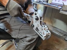 Work on screw tabs to attach additional gearboxes to existing gearboxes