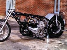 Side by side, twin engined Triumph drag bike. Baby GMC blower with Hilborn fuel injection. Twin , forged Moldex cranks, Carillo rods. Heavily modded Alf Hagon frame. 