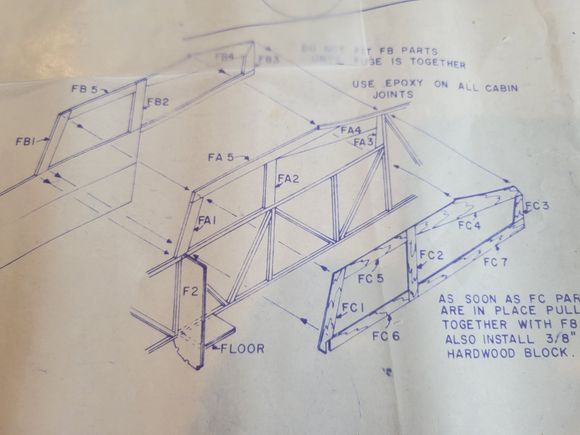Photo (from plans) showing fuselage cabin detail. All the FA parts are sandwiched in between the outer FC parts and the inner FB parts.  