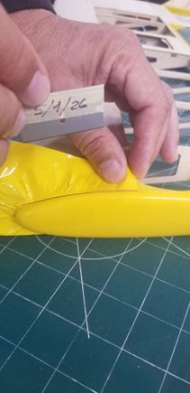 Trimming wing-tip perimeter of excess material -