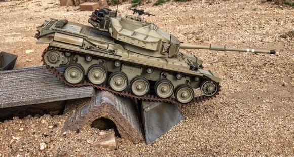 Tamiya Centurion tank on trials course. 