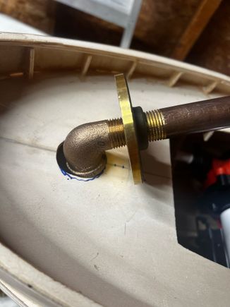 And it fits!  I had to use a 1/2" NPT tap on the bottom side of the flange to open the threads up for the elbow.