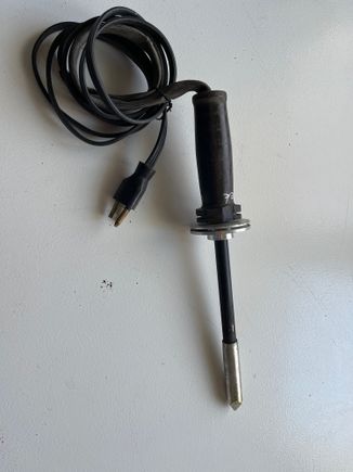 Shop class built soldering iron circa 1963. Solid copper tip, hand wound 75 watt Nichrome heating element, turned Maple handle.   Only the cord has been replaced since 1963.  The new cord was salvaged from a diesel engine block heater about 20 years ago.