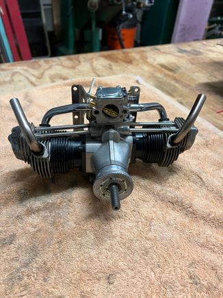 After I got the stock carb off I started the process of figuring out where the Walbro will go.  This looks promising!