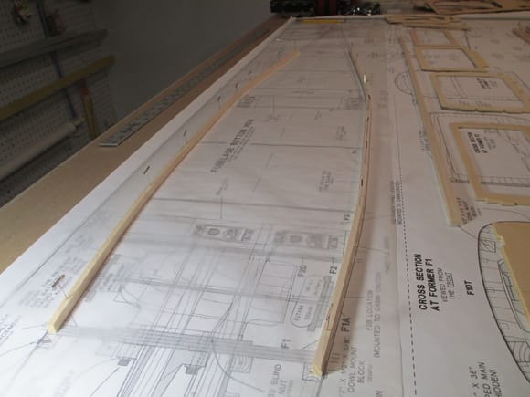 The side stringers were pinned to the build table following the contour of the plans.  