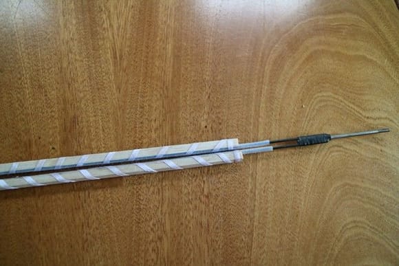 Teflon tube bound to balsa with narrow ribbon and glued with thin CA.