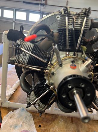 The oil line just exits the bracket towards the front.  When the cowl is on it naturally wants to truck right into front rim. Note nifty red cap.  