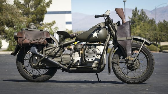 Rare, Harley XA model from WWII.
Would be right at home in Texas with the leather bags and loaded Winchester 73 in the scabbard!

   Or maybe even in Dave's driveway;)