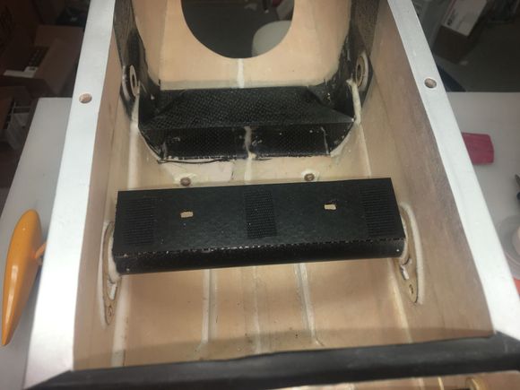 My equipment tray is made from 1/8" CF Nomex honeycomb composite.  I am not a real fan of this material as it is difficult to glue the edges on it but it worked OK for this purpose and is light and stiff.  It is glued to the wing tube and will support the receiver, batteries and regulators.