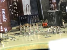 Again, the capacitor on the left looks like C6. DA1 and TR7 is front and center. Use an acid brush with isopropyl alcohol along the legs and bottom edge of these components. I see a green tinge on the bottom of TR7.