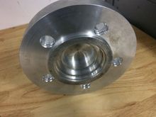 Custom front spacer centres from inside to rx7 hub. Outer ring centers rotor. Other side centers wheel. Use a 3.25 arp stud !