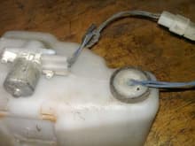 Washer tank with motor and sensor with wiring
