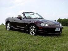 My 2000 Limited ED Miata. New (no roll bar) and just up at VIR to Watch a GrandAm type Race.