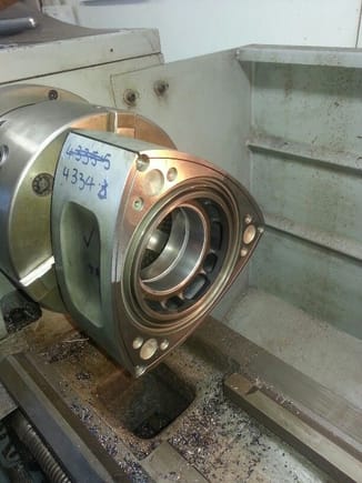 Machining the out oil groove in the rotor bearings.