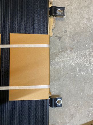 Widened the OEM holes so I could insert some rubber spacers 