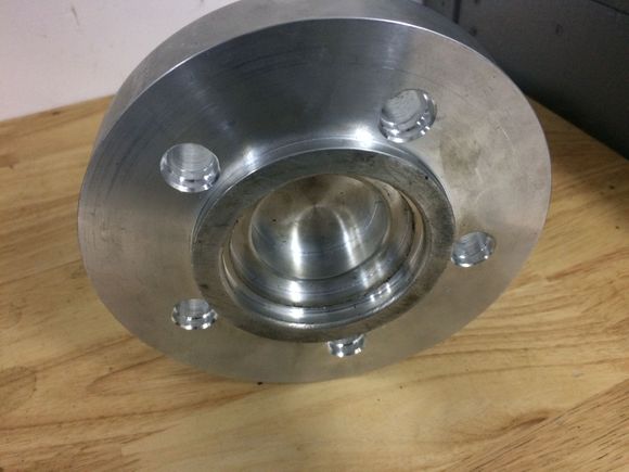 Custom front spacer centres from inside to rx7 hub. Outer ring centers rotor. Other side centers wheel. Use a 3.25 arp stud !