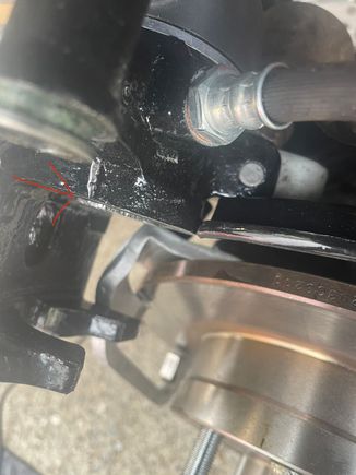 Silver part indicated by red arrow is amount piston projects from caliper. 