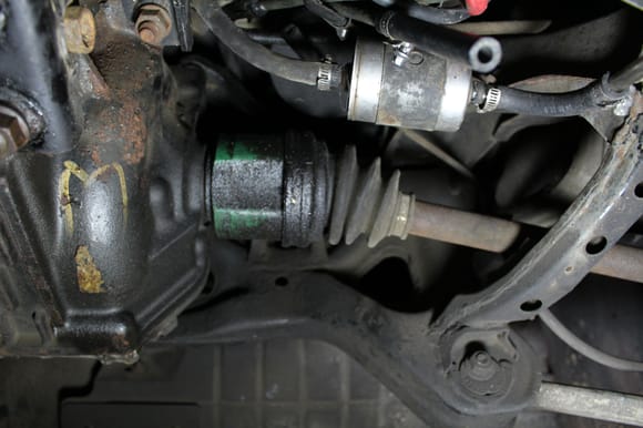 Relocated fuel filter - you can see charcoal canister still present and the "cut" line that came from the original fuel filter location near the top right of the photo.