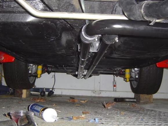 shot of waterpipes running below car