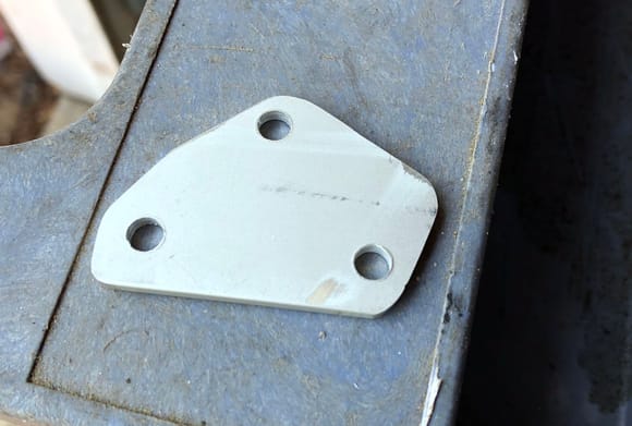 Block-off plate for high altitude compensator on the carb'd 12A.