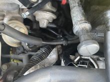 Mechanic put a nail in the hose so it wouldnt create a Vacuum. Middle of the picture. 