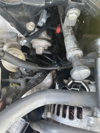 Mechanic put a nail in the hose so it wouldnt create a Vacuum. Middle of the picture. 