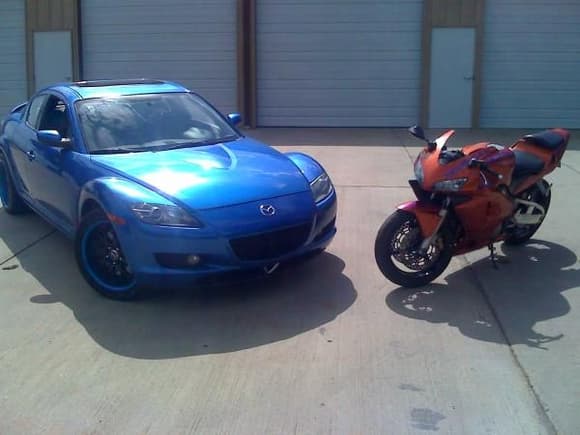 my two toys. winning blue RX8, custom burnt orange CBR600RR with winning blue tribal designs.