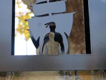 Looks like a photo of folks at the first Thanksgiving under the cutout.