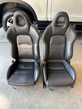 Drivers seats side by side. You can see how far gone my seat was on the left.