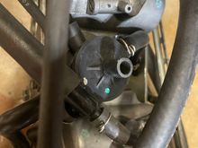 The center black thing is what I'm trying to figure out what it is and what connects to it.  