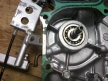 Crankcase cover that has water pump bearing with hose plumbed to the bearings