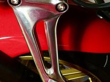 Baby steps... L-R passenger bracket and peg, stripped, polished, and mounted!