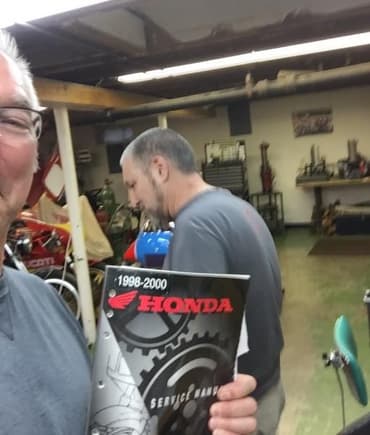 So last night Ducati Tuner/Builder/Restorer extrodinaire Mike Weber took time out of his mega busy schedule to press fit the water pump impeller back into my VTR1000F engine case.  At the end I thanked him for his help and tried to take a celebratory selfie of us while holding up the Honda manual!  Mike was having none of that and so, dropped the clutch, pulled a u-ey and started to exit the frame!  Too slow Duc man, too slow!  Hahahahahahaha!