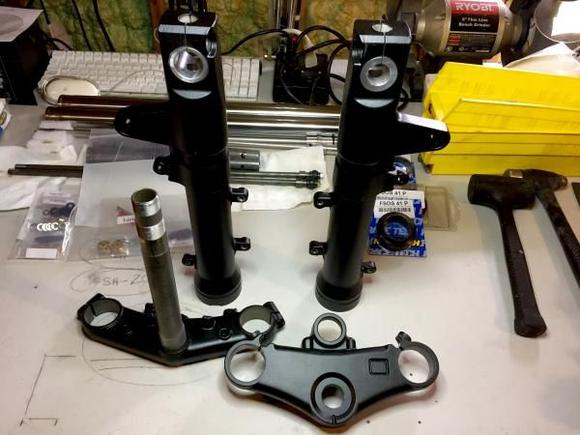 Even though they have been done for two weeks, I finally got my fork legs and triples back from the powdercoaters. Now I just need the time for the rebuild...