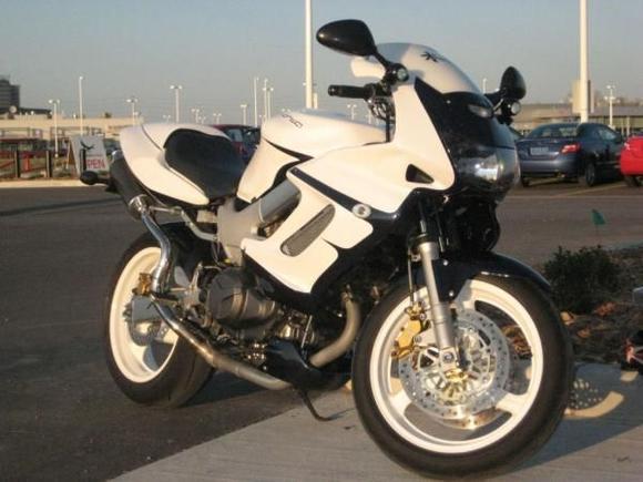 painted white with blue pearl, white powder coated wheels