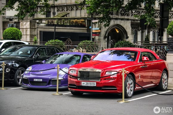 Supercars from Qatar: Lovely combo of this Red Rolls Royce Dawn and Ultraviolet Porsche 991 GT3 RS at the Dorchester Hotel in London.