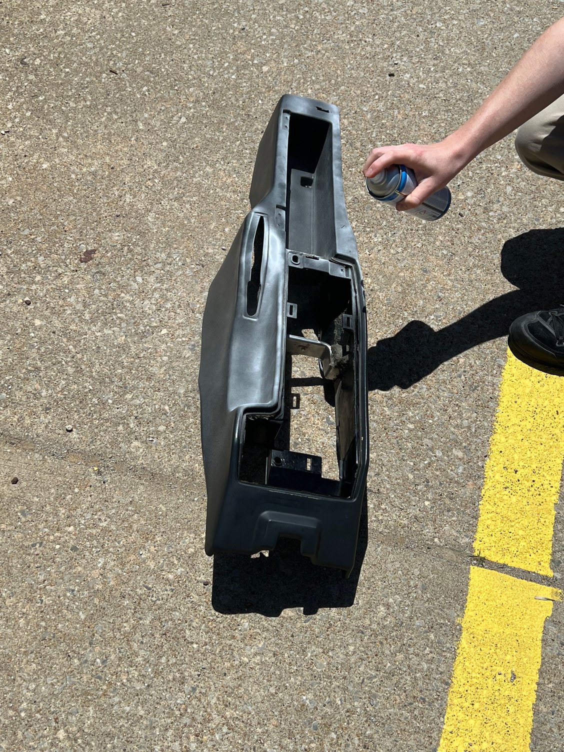 Spraying the console with specialty paint