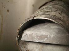 Tank has a baffle wall just a few inches from the end of the fill tube.