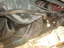 One side bolted to the axle housing.