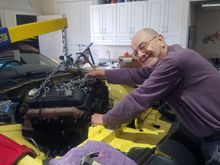 Father lending a hand to keep the engine from crashing into the firewall.  I'd wanted to install my load leveler, but there wasn't enough room along the back side of the head to install the bracket.